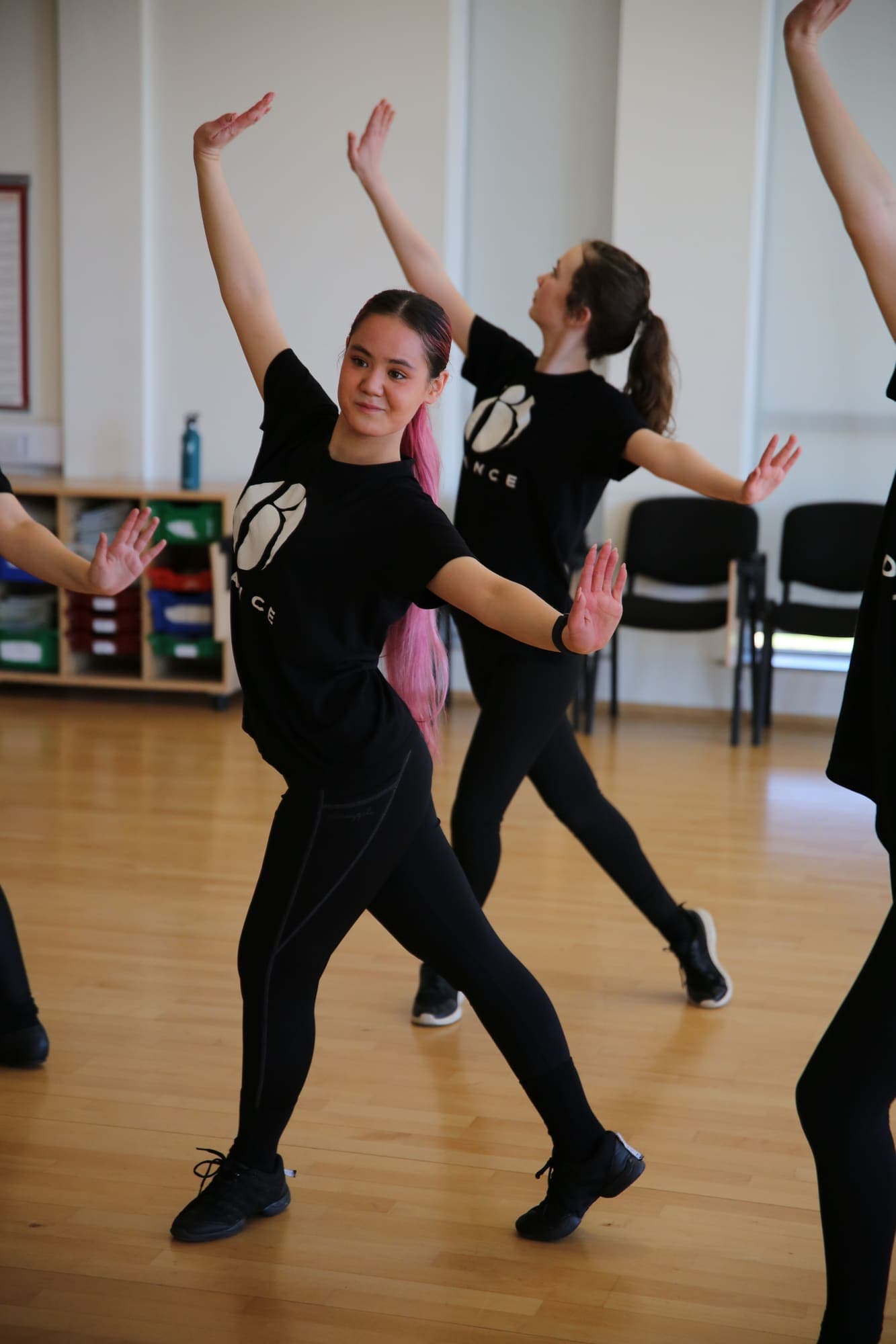 Dancers moving through a jazz routine
