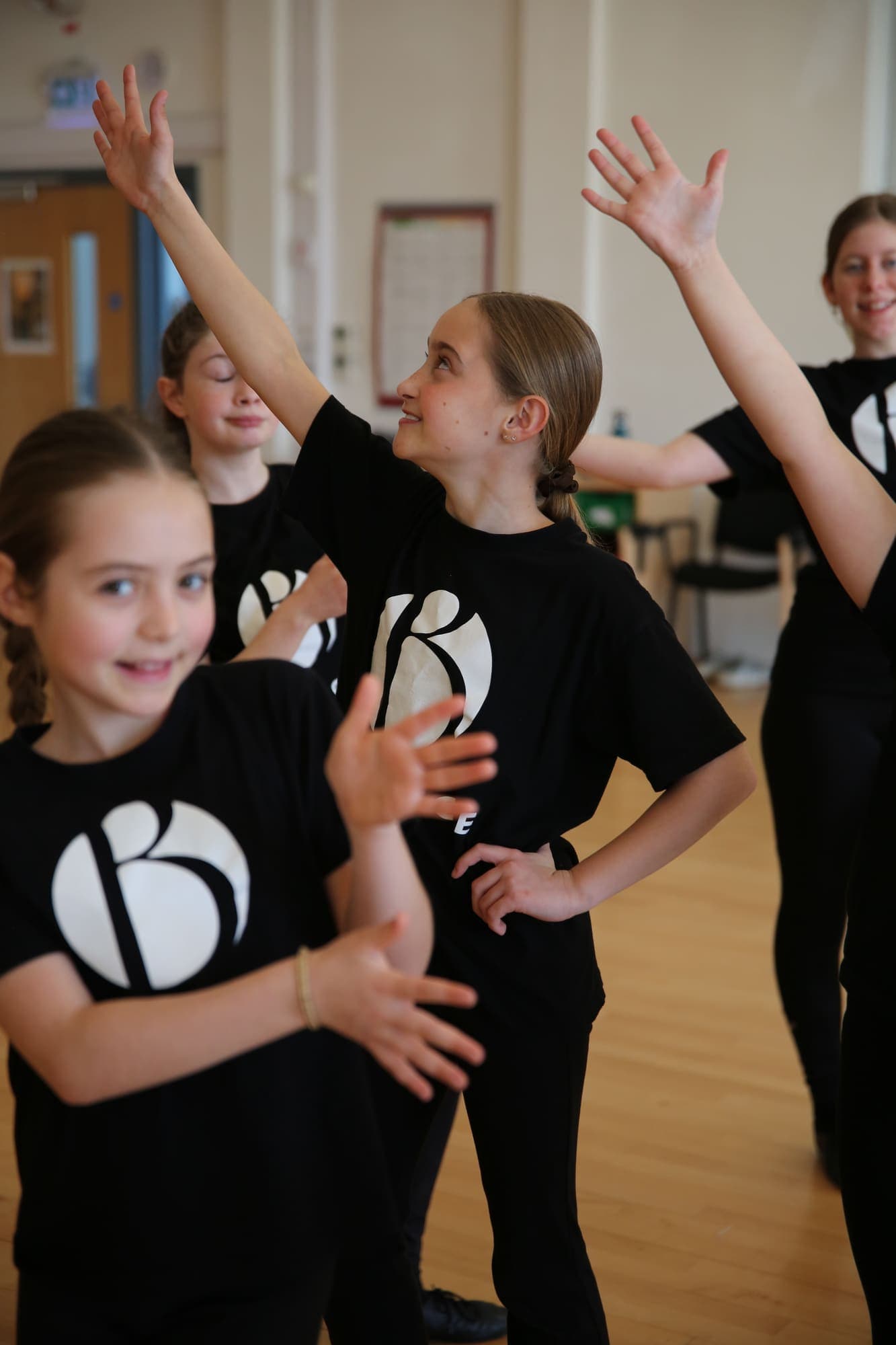 Two junior dancers striking a pose together